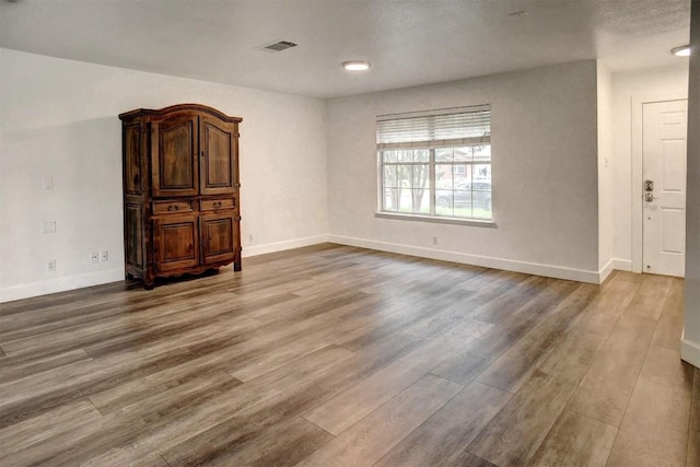742 Annika Way, Bastrop, TX 78602 - spare room featuring wood finished floors and baseboards