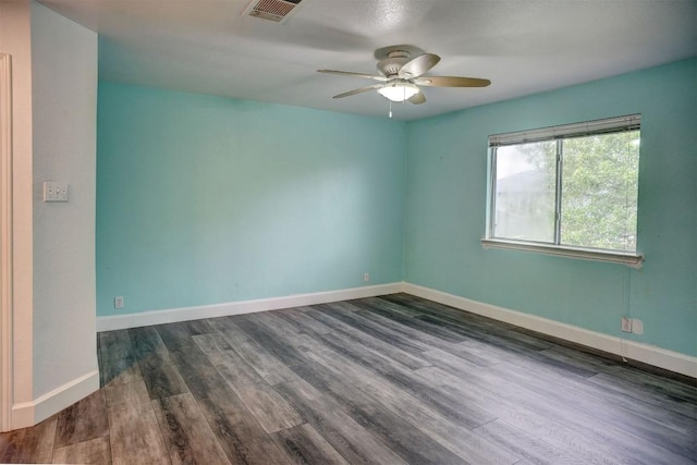 742 Annika Way, Bastrop, TX 78602 - spare room featuring ceiling fan and dark wood-style floors