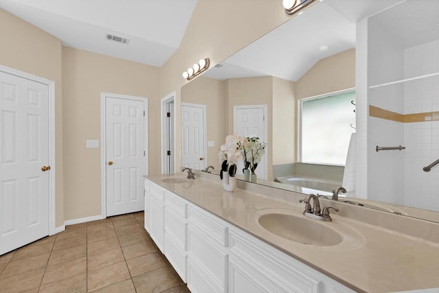 207 Golf Crest Ln, Lakeway, TX 78734 - bathroom featuring double vanity, a garden tub, tile patterned floors, and a shower