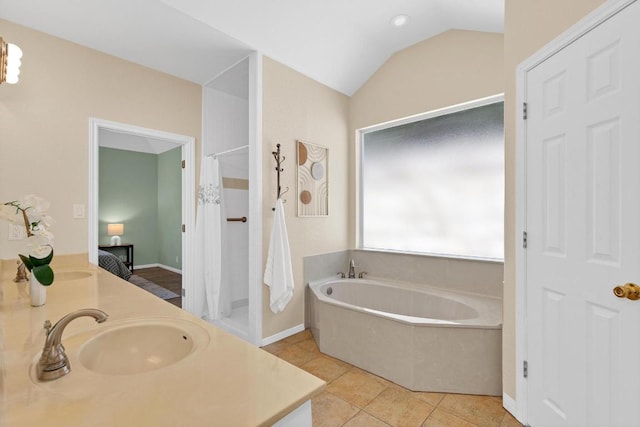 207 Golf Crest Ln, Lakeway, TX 78734 - bathroom with a garden tub, double vanity, curtained shower, lofted ceiling, and tile patterned flooring