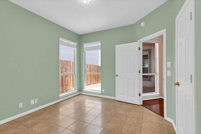 207 Golf Crest Ln, Lakeway, TX 78734 - tiled empty room with baseboards