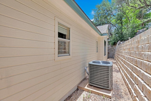 207 Golf Crest Ln, Lakeway, TX 78734 - view of property exterior featuring a cooling unit and a shingled roof