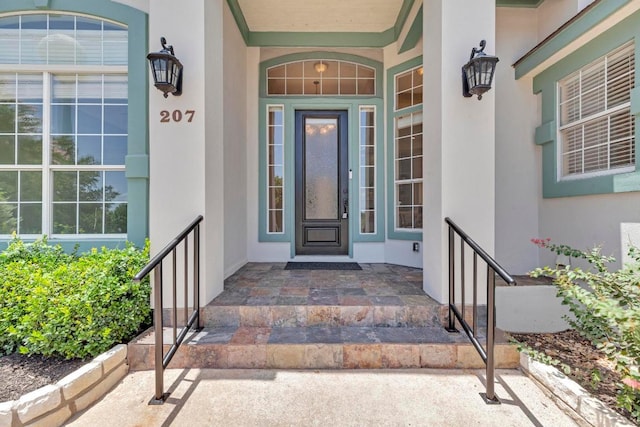 207 Golf Crest Ln, Lakeway, TX 78734 - doorway to property with stucco siding and a porch