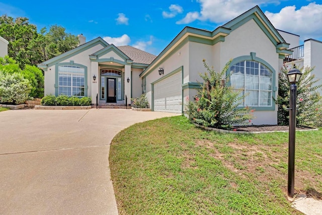 207 Golf Crest Ln, Lakeway, TX 78734 - view of front of house featuring driveway and stucco siding