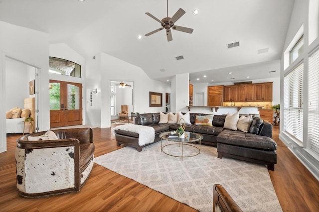 9 Heatherbloom Ln, The Hills, TX 78738 - living room featuring ceiling fan, high vaulted ceiling, wood finished floors, french doors, and recessed lighting