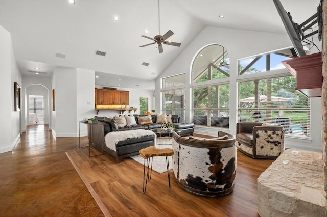 9 Heatherbloom Ln, The Hills, TX 78738 - living area with arched walkways, a ceiling fan, high vaulted ceiling, and recessed lighting