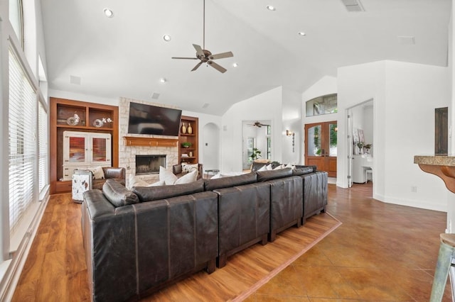 9 Heatherbloom Ln, The Hills, TX 78738 - living area with a ceiling fan, built in features, a fireplace, high vaulted ceiling, and recessed lighting