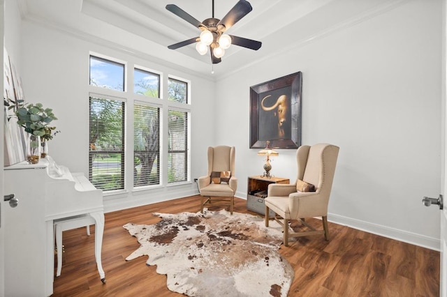 9 Heatherbloom Ln, The Hills, TX 78738 - sitting room featuring wood finished floors, a ceiling fan, crown molding, and a raised ceiling