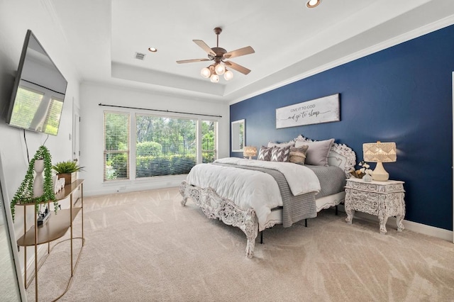 9 Heatherbloom Ln, The Hills, TX 78738 - bedroom featuring carpet, a tray ceiling, multiple windows, a ceiling fan, and recessed lighting