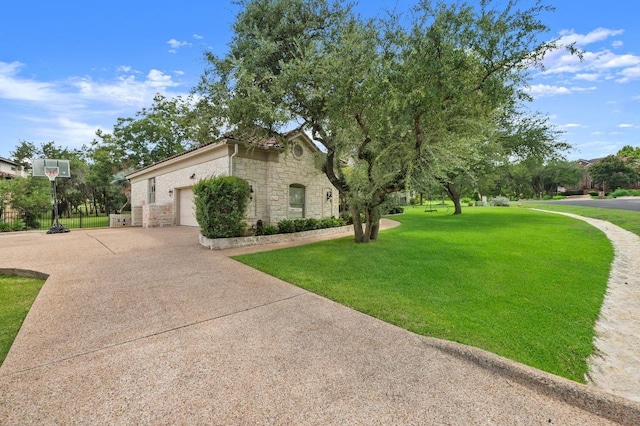 9 Heatherbloom Ln, The Hills, TX 78738 - view of home's exterior with stone siding, a yard, an attached garage, and driveway
