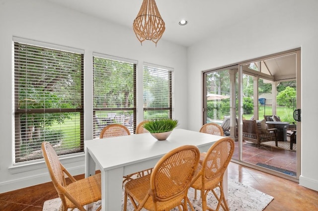 9 Heatherbloom Ln, The Hills, TX 78738 - dining room featuring a chandelier, light tile patterned floors, and recessed lighting