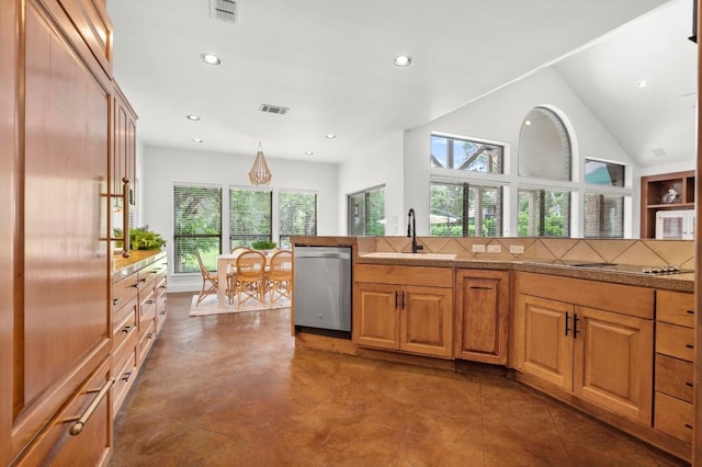 9 Heatherbloom Ln, The Hills, TX 78738 - kitchen featuring dishwasher, plenty of natural light, black electric stovetop, recessed lighting, and brown cabinets