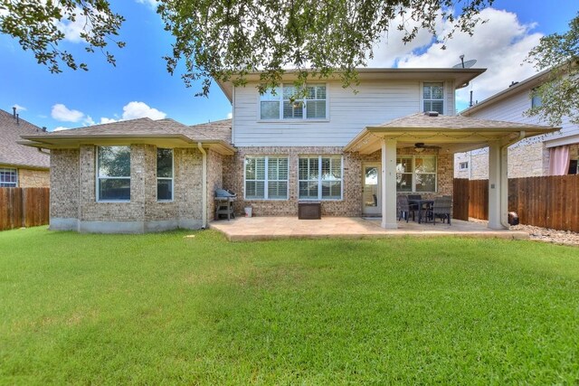 1108 Ritter Dr, Cedar Park, TX 78613 - back of property with a fenced backyard, a patio, and brick siding
