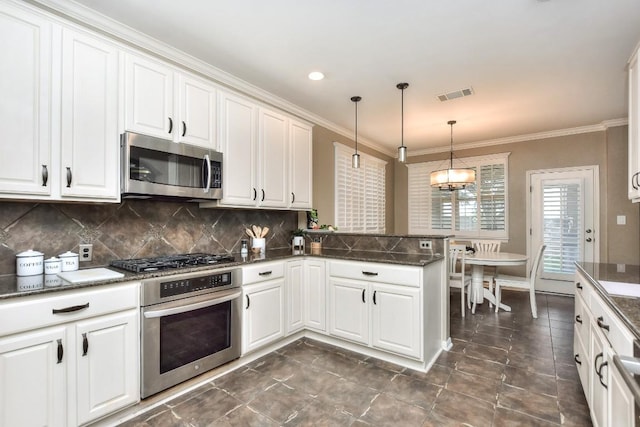 1108 Ritter Dr, Cedar Park, TX 78613 - kitchen with appliances with stainless steel finishes, white cabinets, tasteful backsplash, and ornamental molding