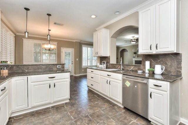 1108 Ritter Dr, Cedar Park, TX 78613 - kitchen with dishwasher, ceiling fan, arched walkways, crown molding, and decorative backsplash