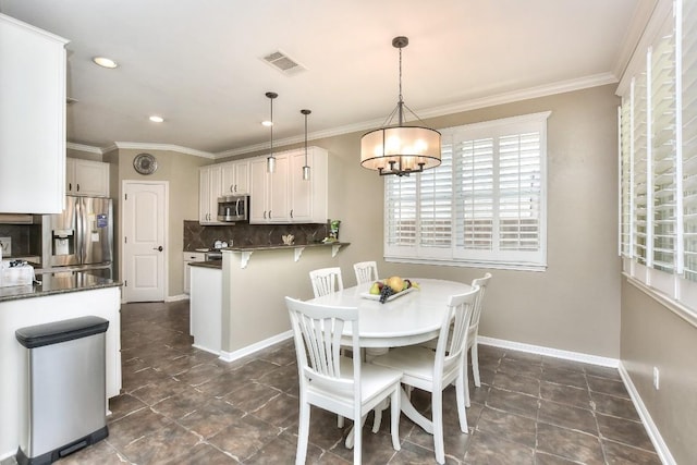 1108 Ritter Dr, Cedar Park, TX 78613 - dining area featuring healthy amount of natural light, a chandelier, crown molding, dark tile patterned floors, and recessed lighting