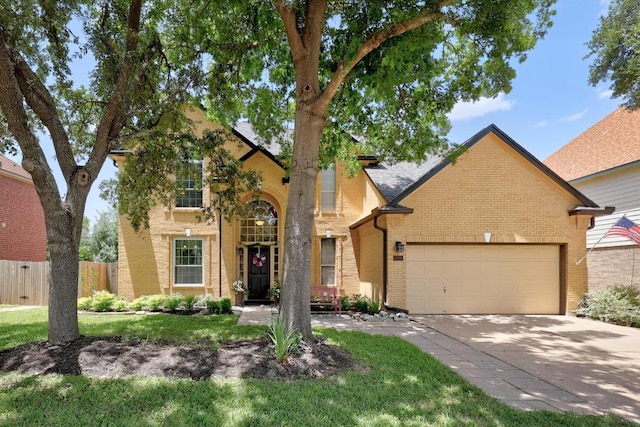 7900 Monona Ave, Austin, TX 78717 - traditional-style house with brick siding, a garage, and driveway
