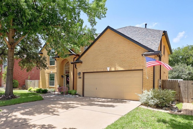 7900 Monona Ave, Austin, TX 78717 - traditional-style home featuring brick siding, an attached garage, concrete driveway, and roof with shingles