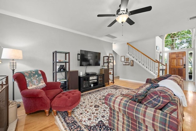 7900 Monona Ave, Austin, TX 78717 - living room with wood finished floors, stairs, ceiling fan, and crown molding