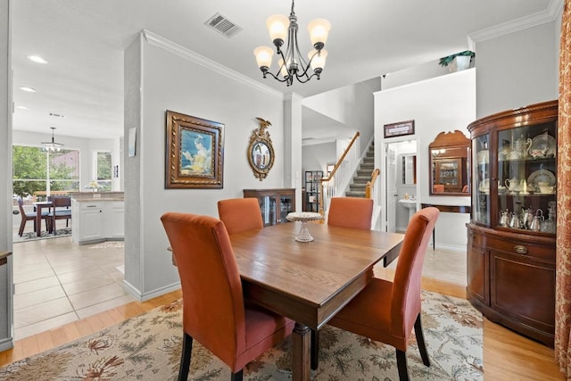 7900 Monona Ave, Austin, TX 78717 - dining room with a chandelier, stairs, light wood-type flooring, crown molding, and recessed lighting
