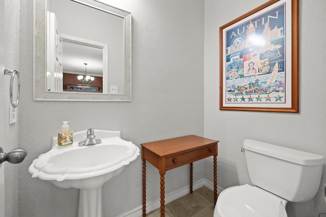 7900 Monona Ave, Austin, TX 78717 - bathroom featuring tile patterned flooring and a chandelier