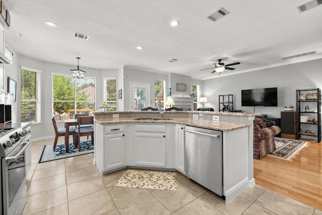 7900 Monona Ave, Austin, TX 78717 - kitchen with appliances with stainless steel finishes, open floor plan, plenty of natural light, a chandelier, and recessed lighting