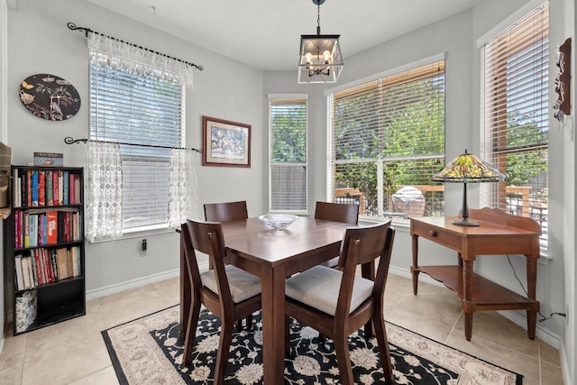 7900 Monona Ave, Austin, TX 78717 - dining area featuring a chandelier and light tile patterned floors