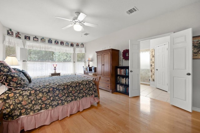 7900 Monona Ave, Austin, TX 78717 - bedroom featuring light wood-type flooring, ceiling fan, and ensuite bath