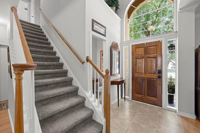 7900 Monona Ave, Austin, TX 78717 - entryway featuring stairway, light tile patterned floors, and a high ceiling