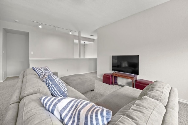 7900 Monona Ave, Austin, TX 78717 - carpeted living area featuring baseboards and track lighting