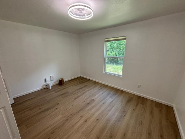 4608 E Village Ct, Austin, TX 78744 - spare room featuring wood finished floors and baseboards