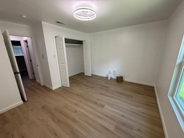 4608 E Village Ct, Austin, TX 78744 - unfurnished bedroom featuring light wood finished floors and a closet