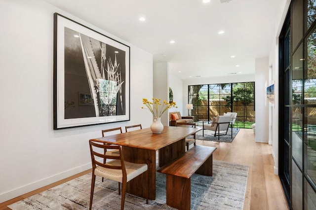 2517 Great Oaks Pkwy, Austin, TX 78756 - dining space with light wood-style floors and recessed lighting