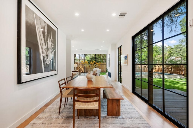 2517 Great Oaks Pkwy, Austin, TX 78756 - dining space featuring light wood finished floors and recessed lighting