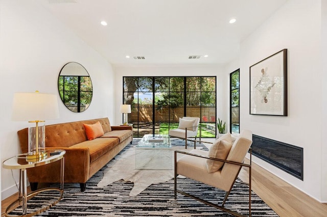2517 Great Oaks Pkwy, Austin, TX 78756 - living area featuring wood finished floors and recessed lighting
