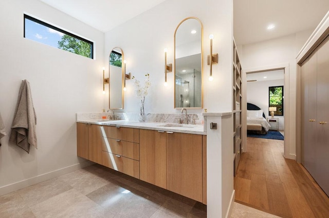 2517 Great Oaks Pkwy, Austin, TX 78756 - ensuite bathroom featuring double vanity, a shower with shower door, and recessed lighting