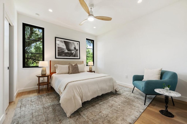 2517 Great Oaks Pkwy, Austin, TX 78756 - bedroom with multiple windows, light wood-style flooring, recessed lighting, and a ceiling fan