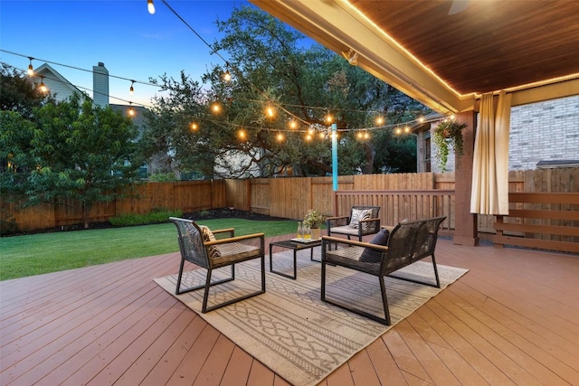 3803 Katie Ln, Cedar Park, TX 78613 - deck at dusk featuring a fenced backyard and an outdoor hangout area