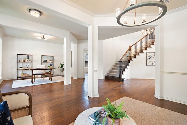 3803 Katie Ln, Cedar Park, TX 78613 - living area featuring a chandelier, dark wood-style flooring, stairs, and crown molding