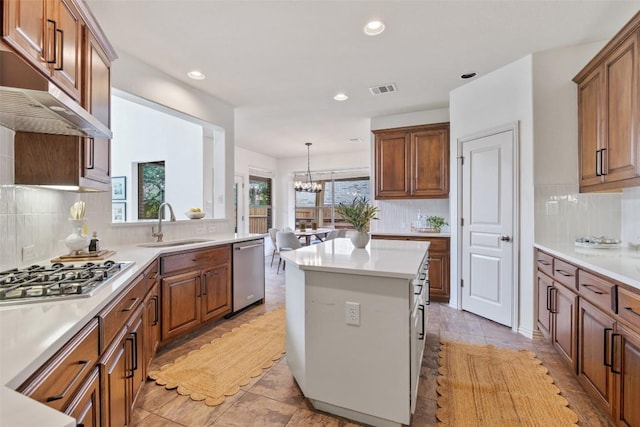 3803 Katie Ln, Cedar Park, TX 78613 - kitchen with stainless steel appliances, backsplash, recessed lighting, brown cabinets, and light countertops