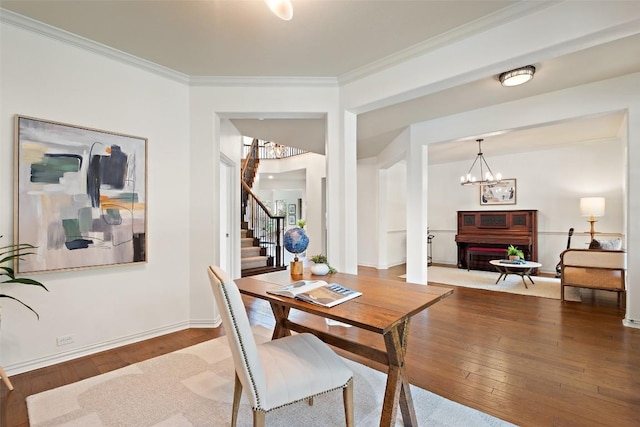 3803 Katie Ln, Cedar Park, TX 78613 - dining room featuring a chandelier, wood-type flooring, stairs, and ornamental molding