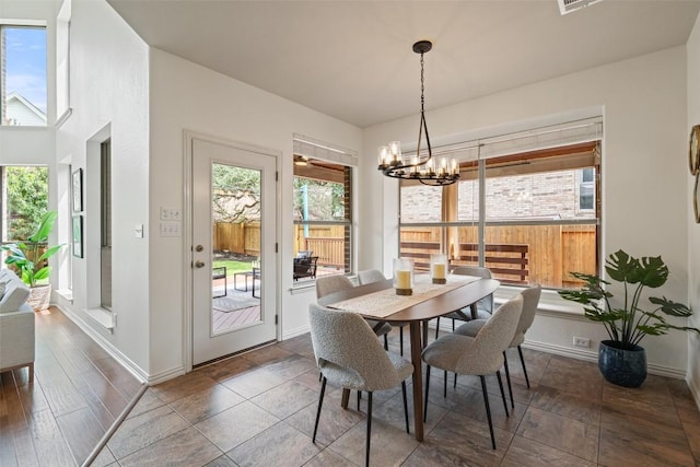 3803 Katie Ln, Cedar Park, TX 78613 - dining room featuring a chandelier and baseboards