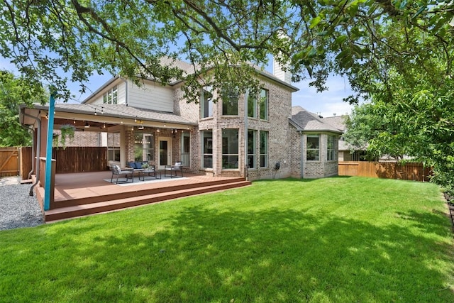 3803 Katie Ln, Cedar Park, TX 78613 - rear view of property with a fenced backyard, brick siding, a deck, a chimney, and an outdoor hangout area