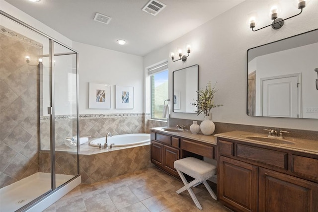 3803 Katie Ln, Cedar Park, TX 78613 - bathroom with double vanity, a bath, a stall shower, and tile patterned flooring