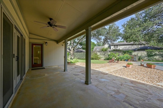 2400 Muirfield Cir, Austin, TX 78747 - fenced backyard with a ceiling fan and a patio