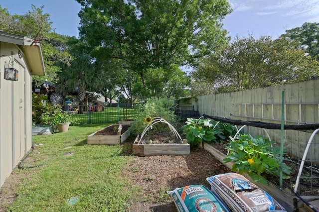 2400 Muirfield Cir, Austin, TX 78747 - fenced backyard featuring a vegetable garden