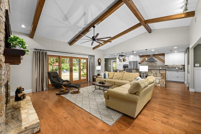 2400 Muirfield Cir, Austin, TX 78747 - living room with beam ceiling, a ceiling fan, light wood finished floors, recessed lighting, and a fireplace