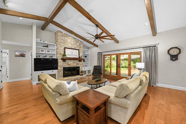 2400 Muirfield Cir, Austin, TX 78747 - living area featuring ceiling fan, light wood-style flooring, a stone fireplace, and built in features