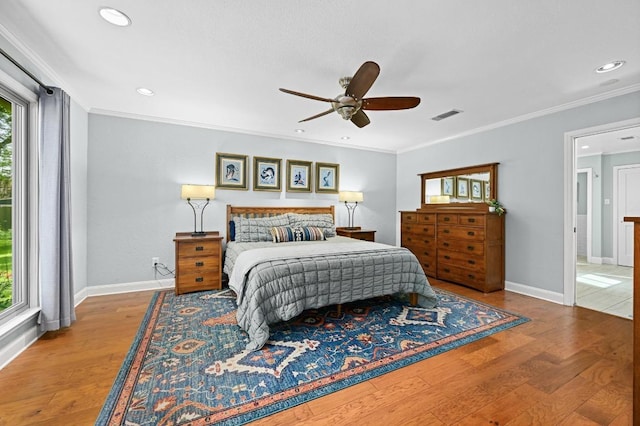 2400 Muirfield Cir, Austin, TX 78747 - bedroom featuring multiple windows, wood finished floors, recessed lighting, ceiling fan, and ornamental molding