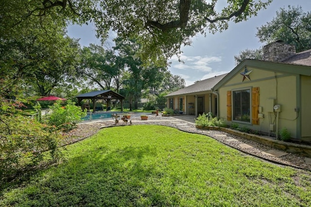 2400 Muirfield Cir, Austin, TX 78747 - view of green lawn with a gazebo and a patio area